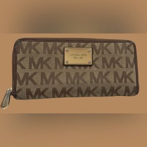 Michael Kors full zip closure wallet.